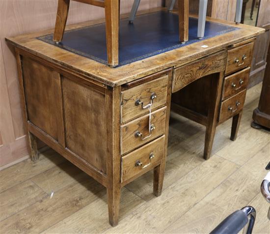 A 1920s oak pedestal desk, W.122cm